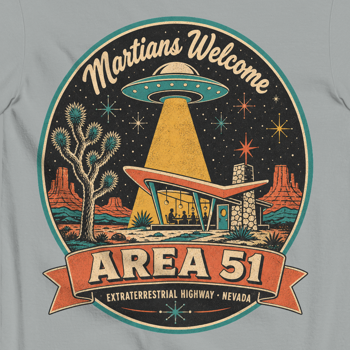 Area 51 Badge T-Shirt in Granite, close-up of the back print, flying saucer beaming down on a retro desert diner