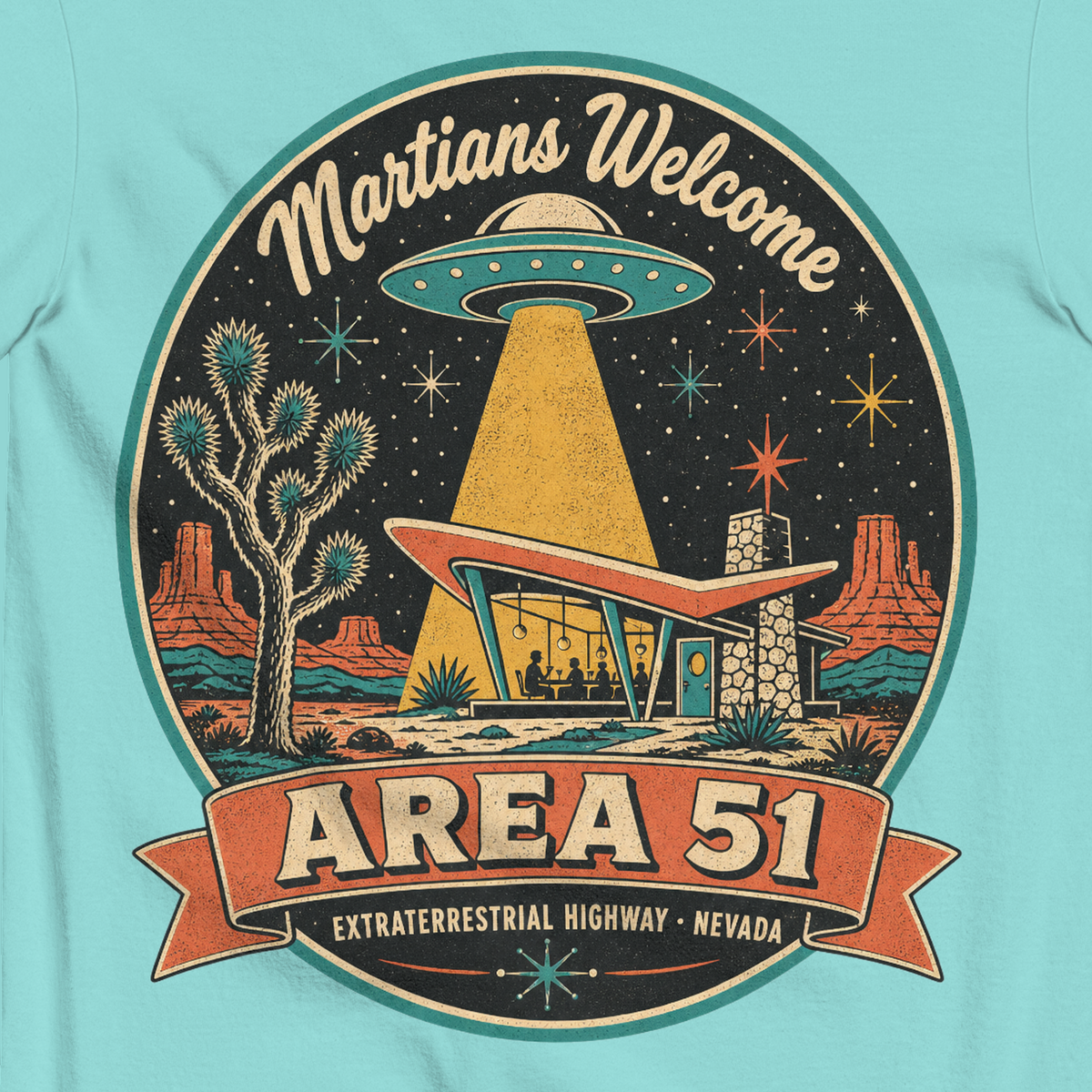 Area 51 Badge T-Shirt in Lagoon Blue, close-up of the back print, flying saucer beaming down on a retro desert diner