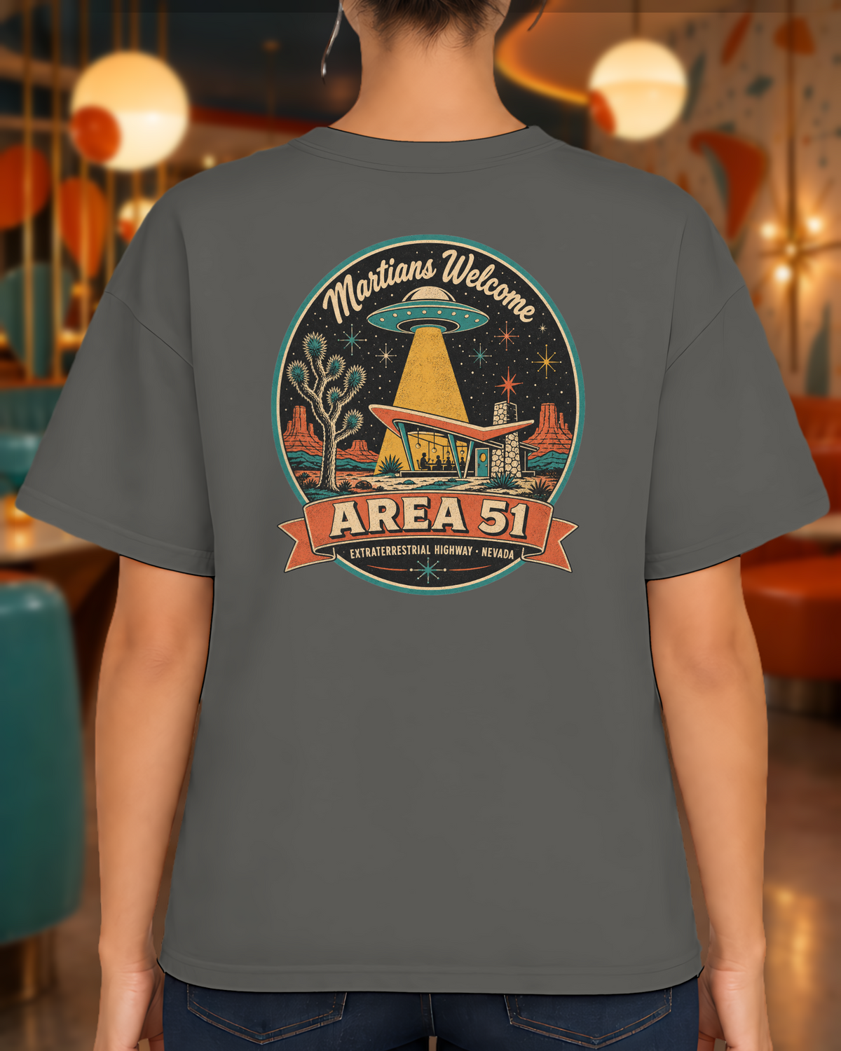 Area 51 Badge T-Shirt lifestyle photo, back view of the Pepper tee in a retro atomic-age cocktail lounge