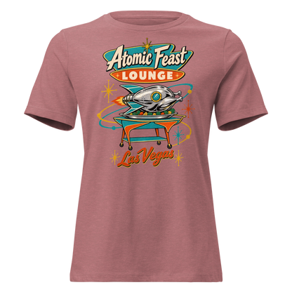 Atomic Feast Lounge Relaxed T-Shirt in Heather Mauve, front view, a chrome rocket-shaped roast turkey on a mid-century serving cart under a Googie sign