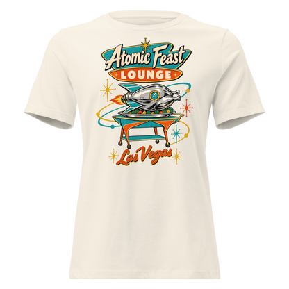 Atomic Feast Lounge Relaxed T-Shirt in Natural, front view, a chrome rocket-shaped roast turkey on a mid-century serving cart under a Googie sign