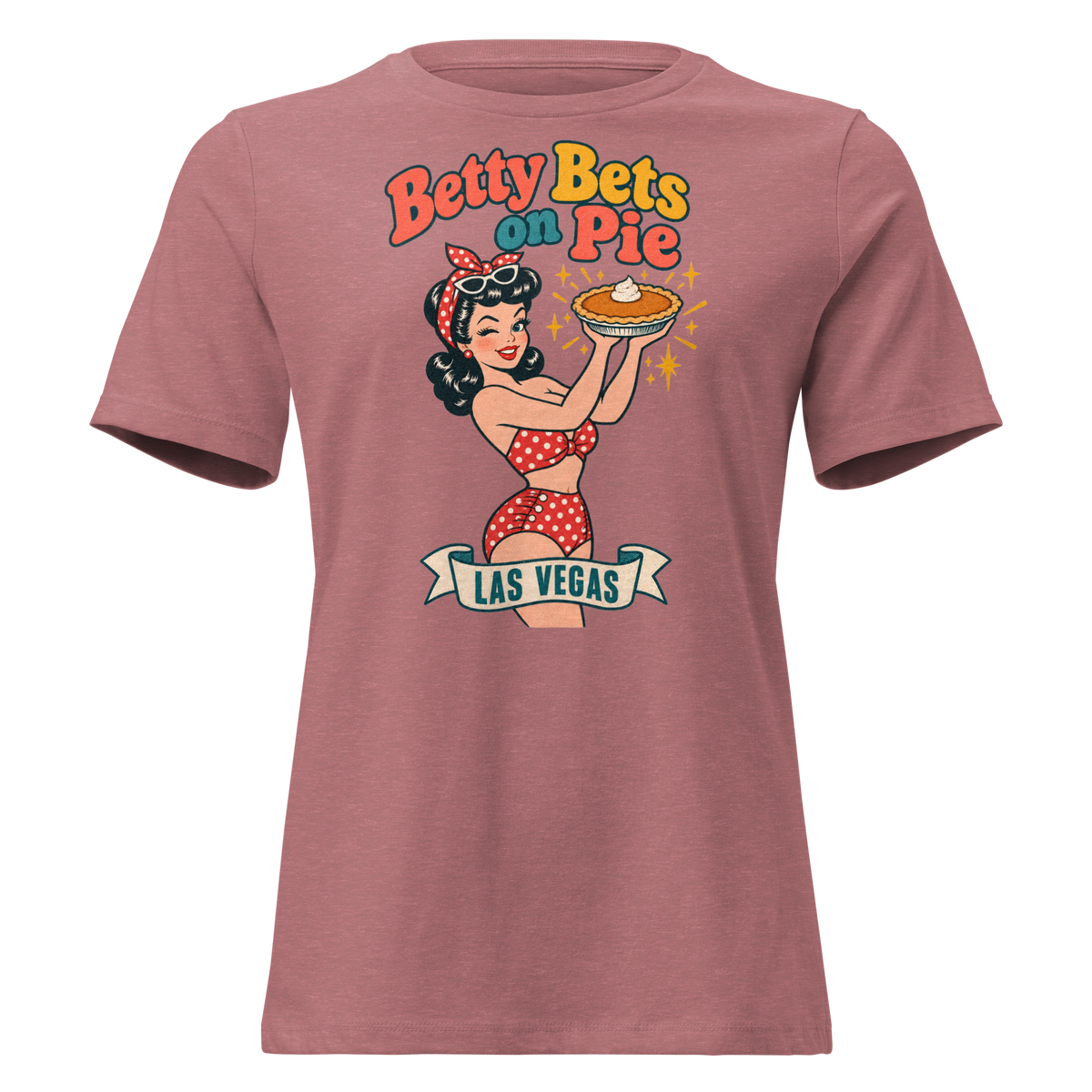 Betty Bets on Pie Relaxed T-Shirt in Heather Mauve, front view, Downtown Betty in a polka dot swimsuit holds up a pumpkin pie like a jackpot and winks