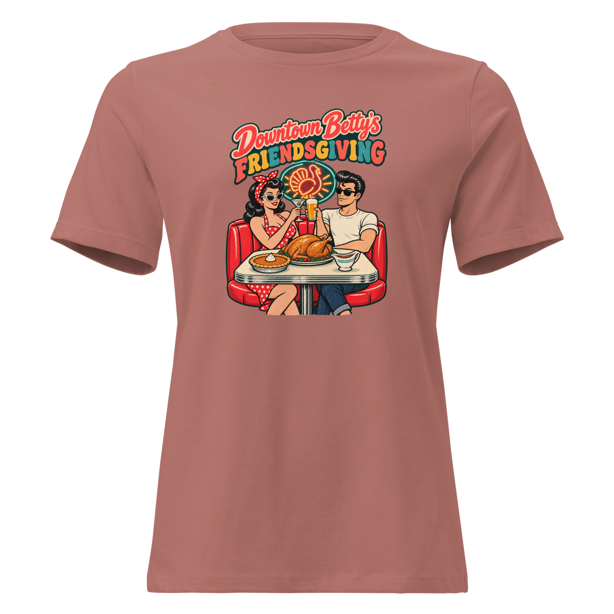 Downtown Betty's Friendsgiving Relaxed T-Shirt in Mauve, front view, Downtown Betty and Fremont Frank toast over a turkey dinner in a retro diner booth