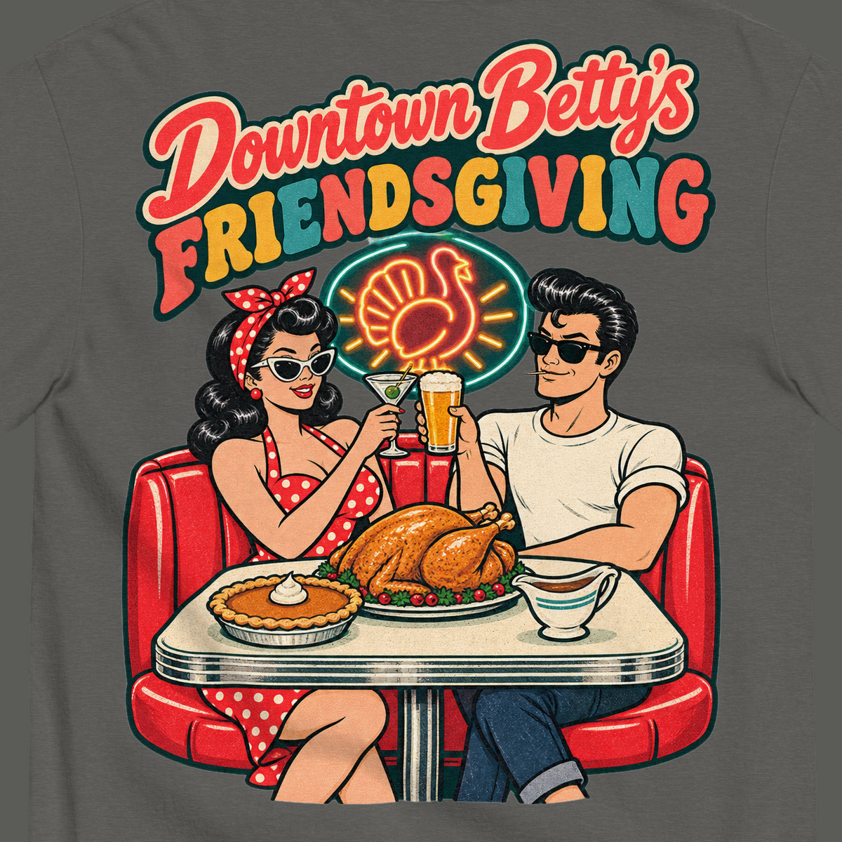 Downtown Betty's Friendsgiving T-Shirt in Pepper, close-up of the back print, Downtown Betty and Fremont Frank toast over a turkey dinner in a retro diner booth