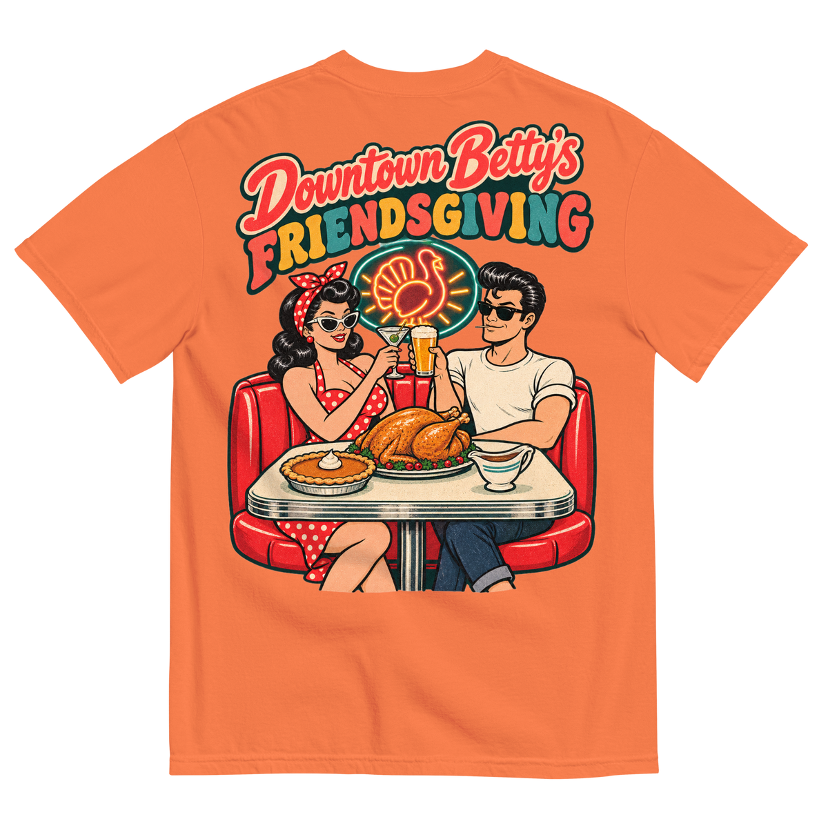 Downtown Betty's Friendsgiving T-Shirt in Burnt Orange, back print, Downtown Betty and Fremont Frank toast over a turkey dinner in a retro diner booth