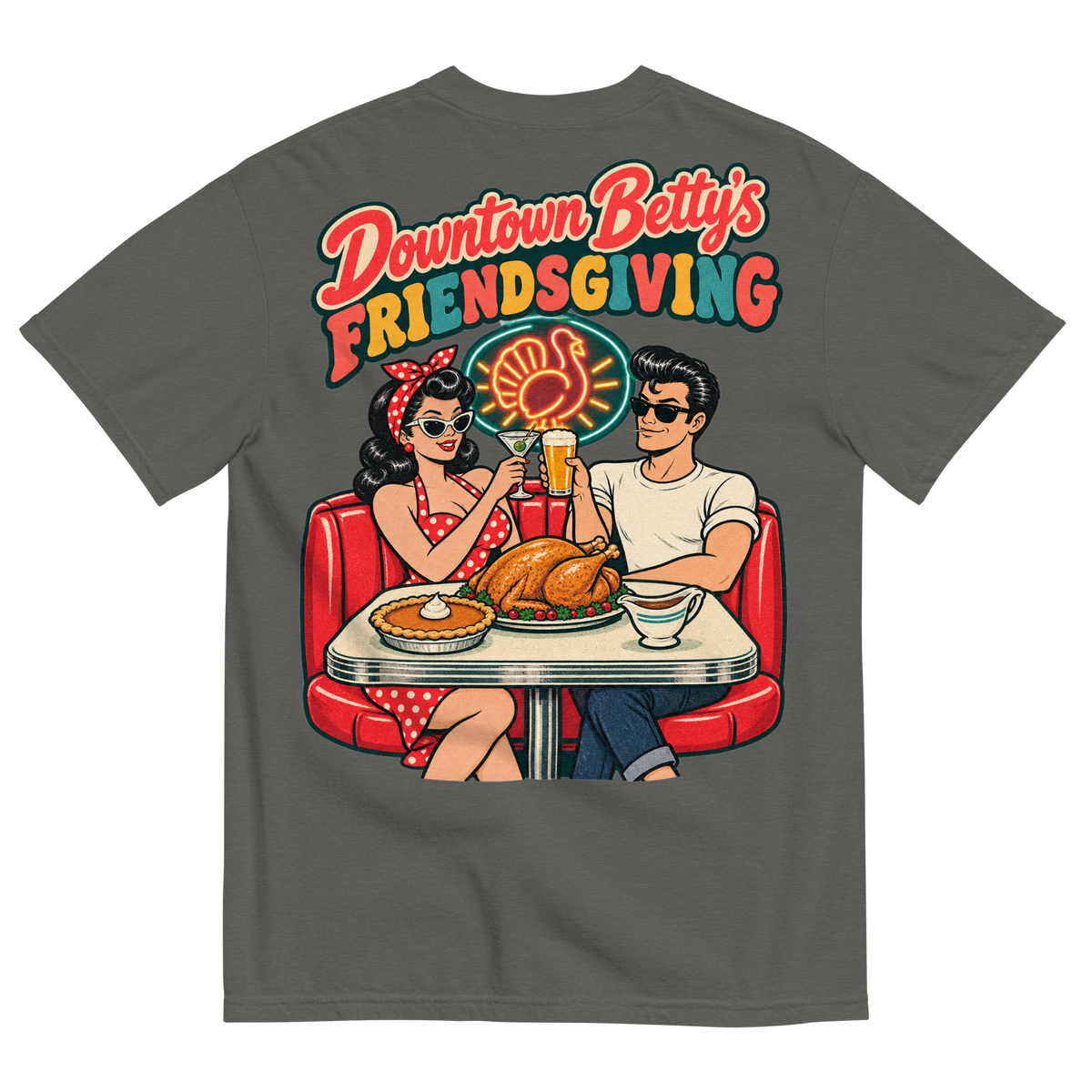 Downtown Betty's Friendsgiving T-Shirt in Pepper, back print, Downtown Betty and Fremont Frank toast over a turkey dinner in a retro diner booth