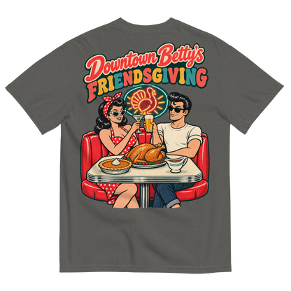 Downtown Betty's Friendsgiving T-Shirt in Pepper, back print, Downtown Betty and Fremont Frank toast over a turkey dinner in a retro diner booth