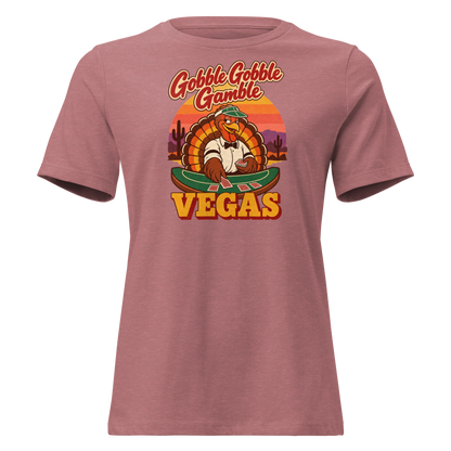 Gobble Gobble Gamble Relaxed T-Shirt in Heather Mauve, front view, a turkey in a green dealer visor deals blackjack at a felt table under a desert sunset