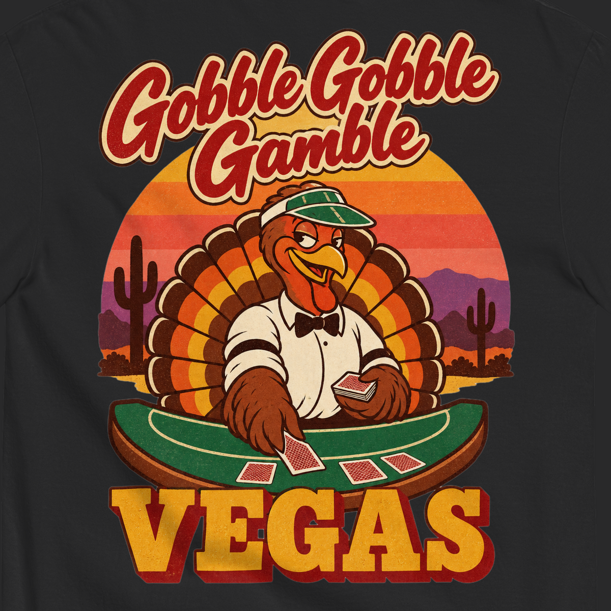 Gobble Gobble Gamble T-Shirt in Black, close-up of the back print, a turkey in a green dealer visor deals blackjack at a felt table under a desert sunset