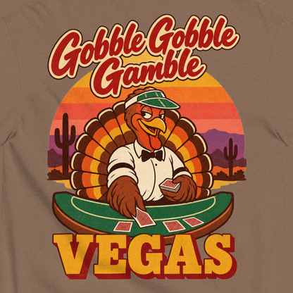 Gobble Gobble Gamble T-Shirt in Espresso, close-up of the back print, a turkey in a green dealer visor deals blackjack at a felt table under a desert sunset