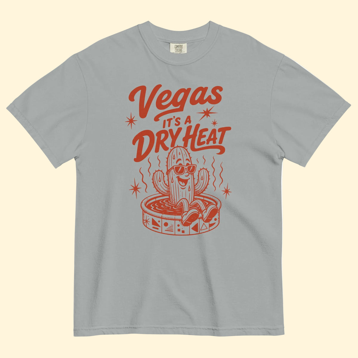 It's A Dry Heat T-Shirt in Granite, front view, cactus in a kiddie pool Las Vegas heat graphic