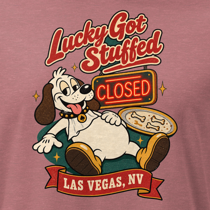 Lucky Got Stuffed Relaxed T-Shirt in Heather Mauve, close-up of the front print, Lucky the dog on his back with a full belly by an empty turkey platter and CLOSED neon