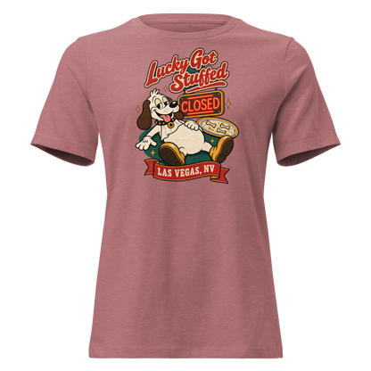 Lucky Got Stuffed Relaxed T-Shirt in Heather Mauve, front view, Lucky the dog on his back with a full belly by an empty turkey platter and CLOSED neon