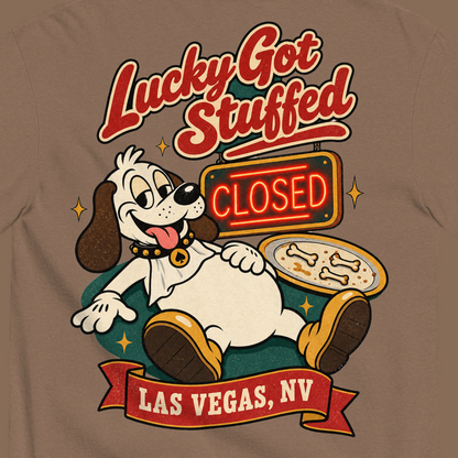 Lucky Got Stuffed T-Shirt in Espresso, close-up of the back print, Lucky the dog on his back with a full belly by an empty turkey platter and CLOSED neon