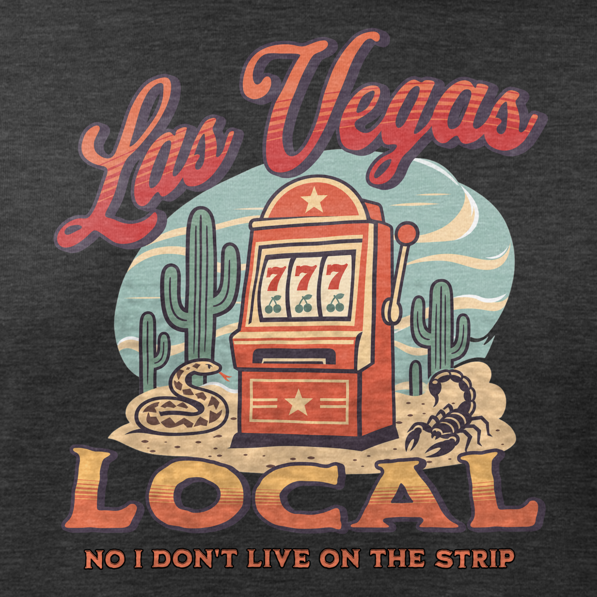 No I Don't Live On The Strip Relaxed T-Shirt in Dark Grey Heather, close-up of the front print, retro slot machine on triple 7s among saguaros with a rattlesnake and scorpion