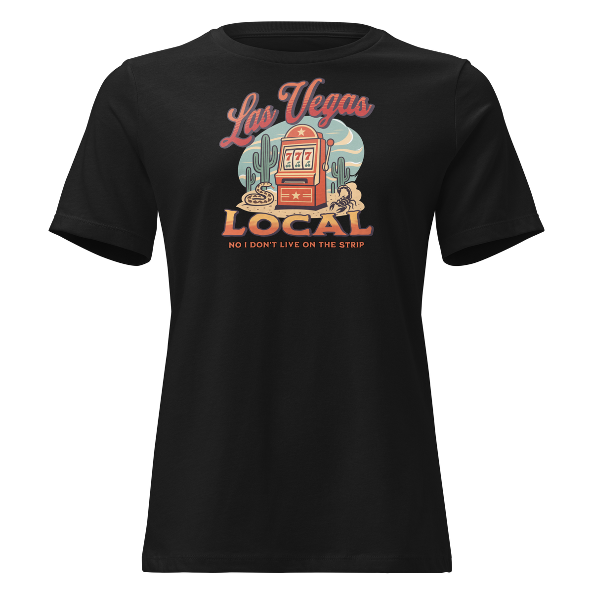 No I Don't Live On The Strip Relaxed T-Shirt in Black, front view, retro slot machine on triple 7s among saguaros with a rattlesnake and scorpion