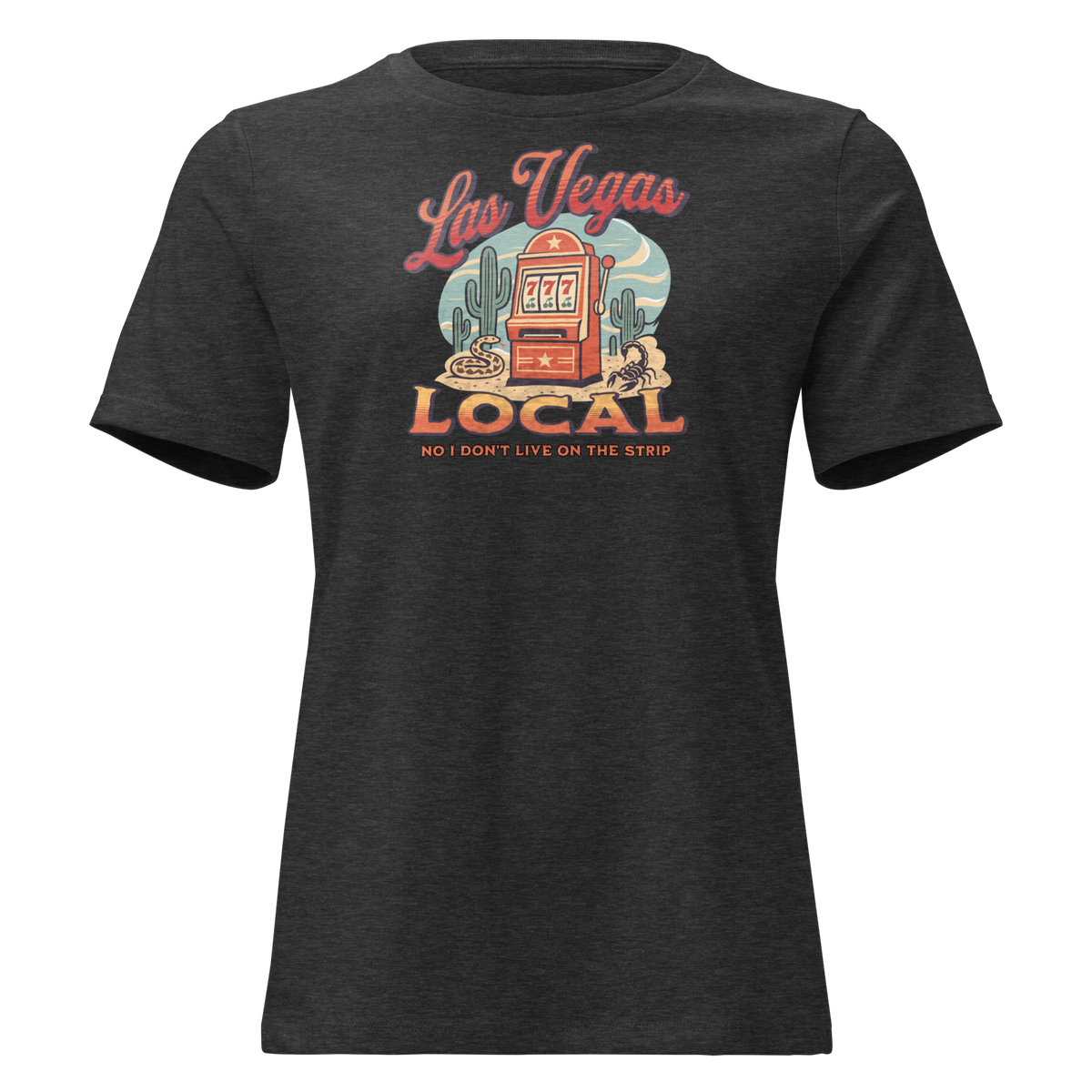 No I Don't Live On The Strip Relaxed T-Shirt in Dark Grey Heather, front view, retro slot machine on triple 7s among saguaros with a rattlesnake and scorpion