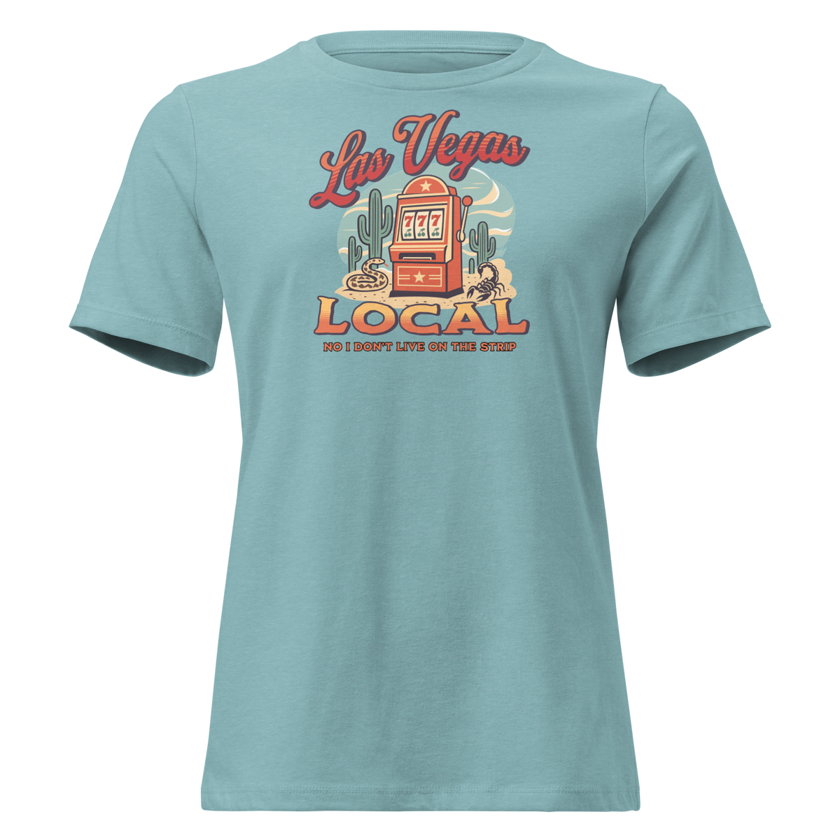 No I Don't Live On The Strip Relaxed T-Shirt in Heather Blue Lagoon, front view, retro slot machine on triple 7s among saguaros with a rattlesnake and scorpion