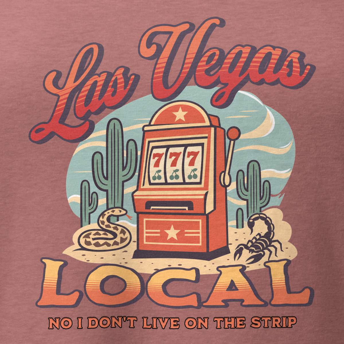 No I Don't Live On The Strip V-Neck in Heather Mauve, close-up of the front print, retro slot machine on triple 7s among saguaros with a rattlesnake and scorpion