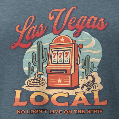 No I Don't Live On The Strip V-Neck in Heather Slate, close-up of the front print, retro slot machine on triple 7s among saguaros with a rattlesnake and scorpion