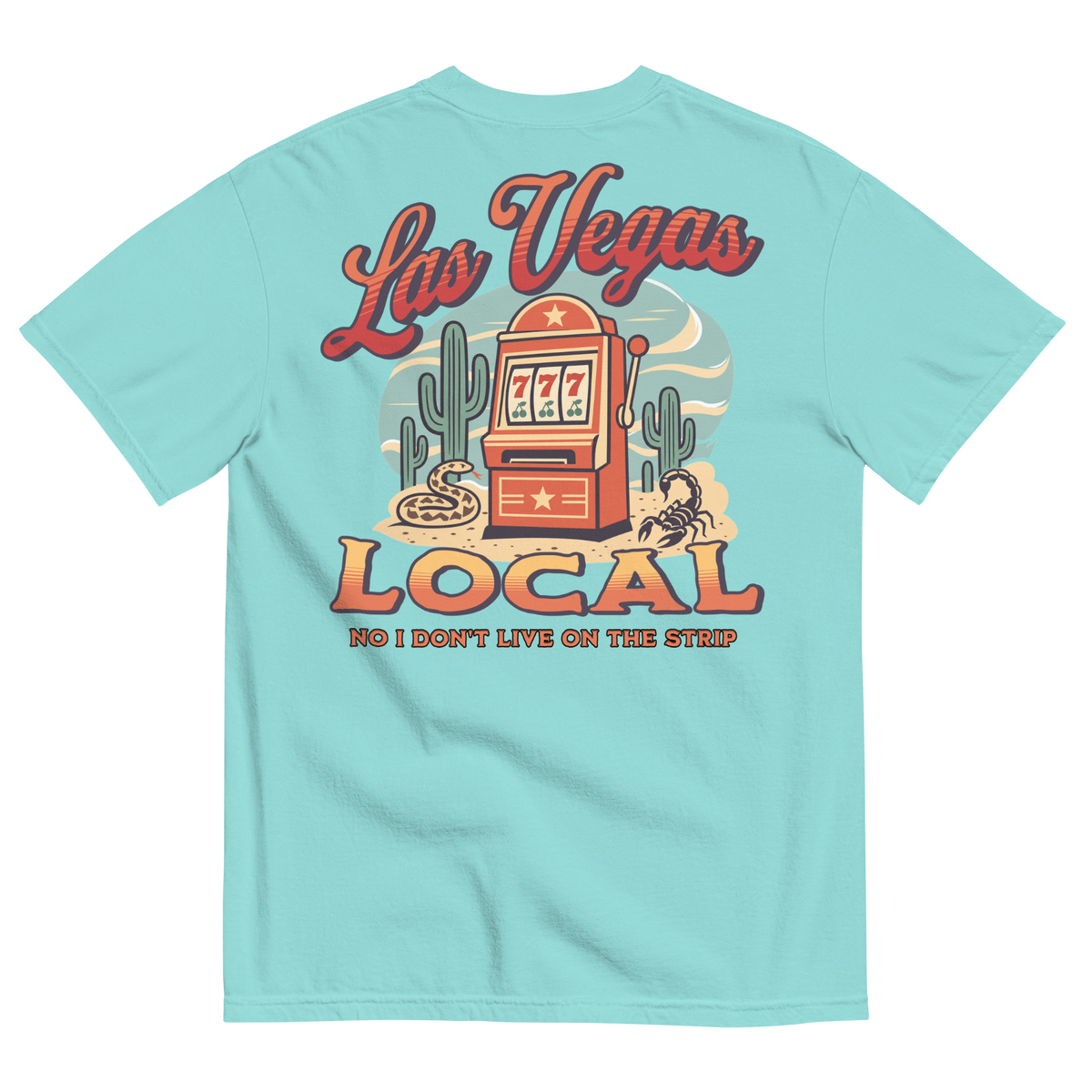 No I Don't Live On The Strip T-Shirt in Lagoon Blue, back print, retro slot machine on triple 7s among saguaros with a rattlesnake and scorpion