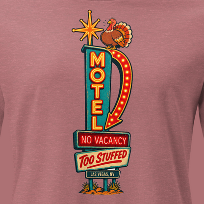 No Vacancy, Too Stuffed Relaxed T-Shirt in Heather Mauve, close-up of the front print, a vintage motel neon sign reading No Vacancy, Too Stuffed with a full turkey on top