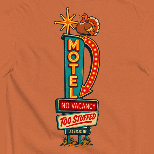 No Vacancy, Too Stuffed T-Shirt in Yam, close-up of the back print, a vintage motel neon sign reading No Vacancy, Too Stuffed with a full turkey on top
