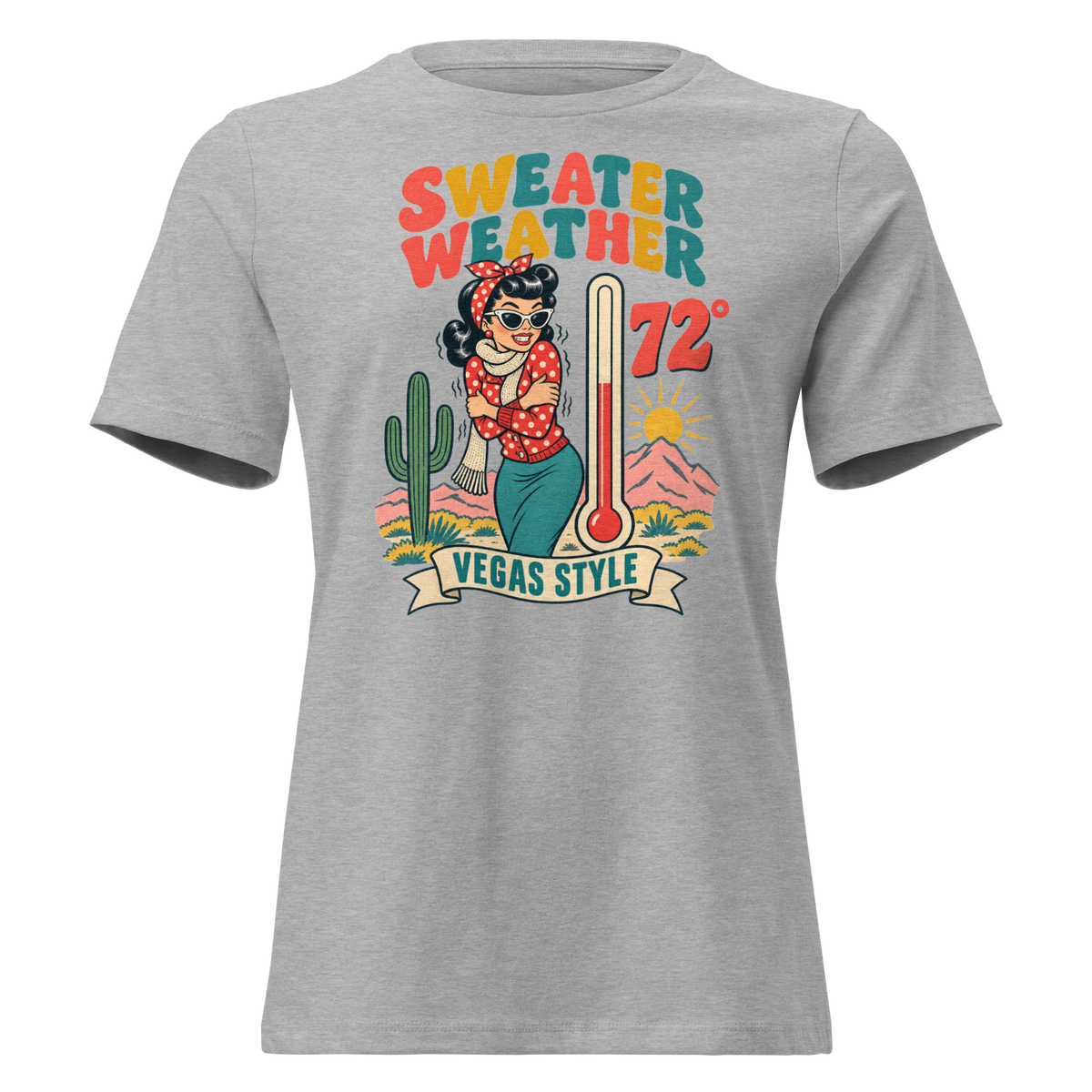 Sweater Weather Relaxed T-Shirt in Athletic Heather, front view, Downtown Betty shivering in a scarf beside a thermometer reading 72 degrees and a cactus