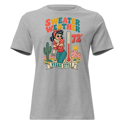 Sweater Weather Relaxed T-Shirt in Athletic Heather, front view, Downtown Betty shivering in a scarf beside a thermometer reading 72 degrees and a cactus