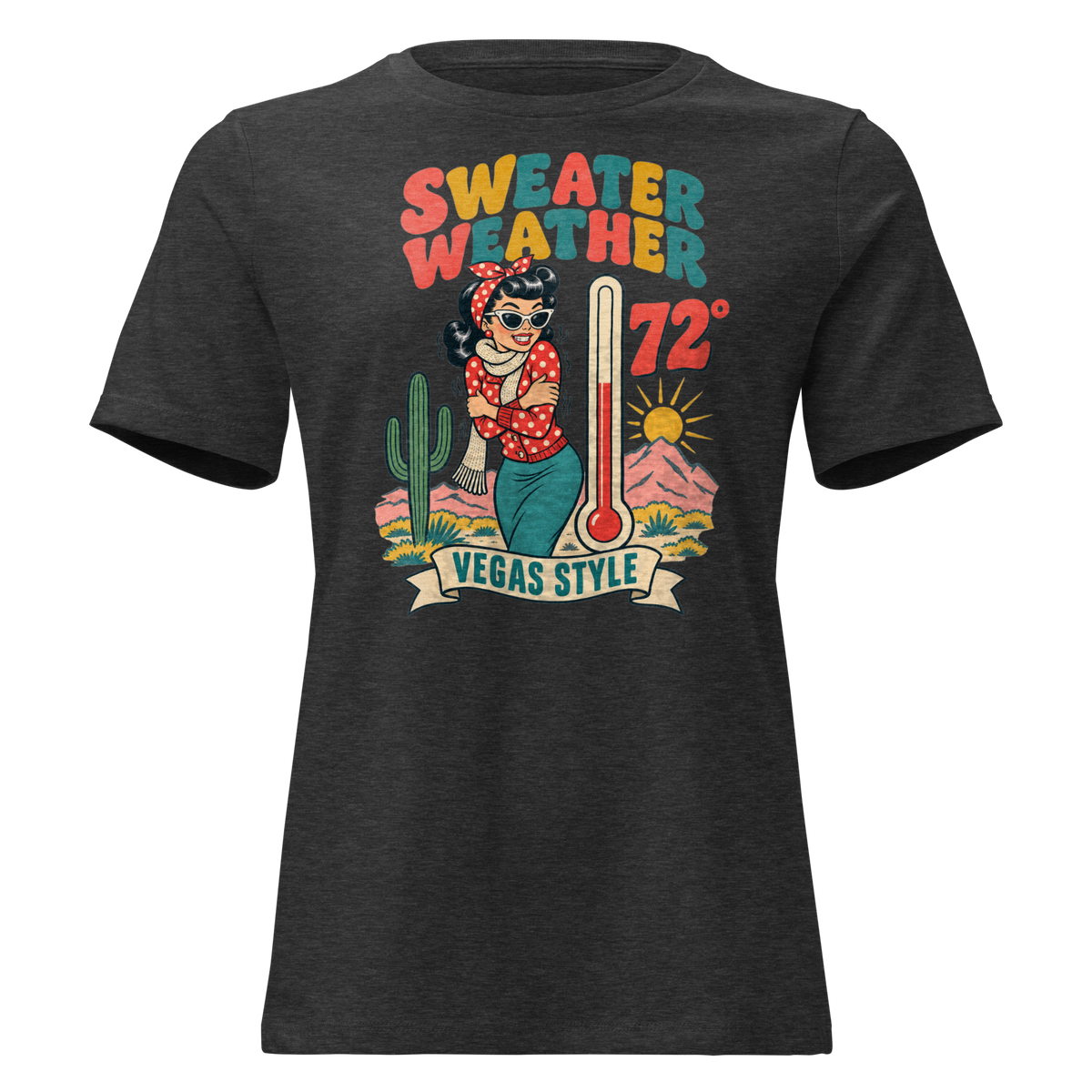 Sweater Weather Relaxed T-Shirt in Dark Grey Heather, front view, Downtown Betty shivering in a scarf beside a thermometer reading 72 degrees and a cactus