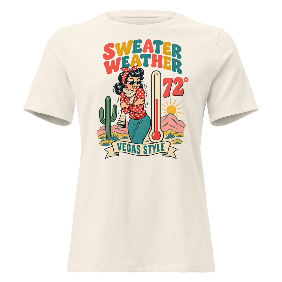 Sweater Weather Relaxed T-Shirt in Natural, front view, Downtown Betty shivering in a scarf beside a thermometer reading 72 degrees and a cactus