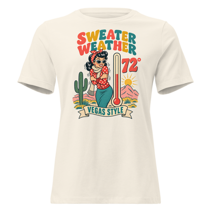 Sweater Weather Relaxed T-Shirt in Natural, front view, Downtown Betty shivering in a scarf beside a thermometer reading 72 degrees and a cactus