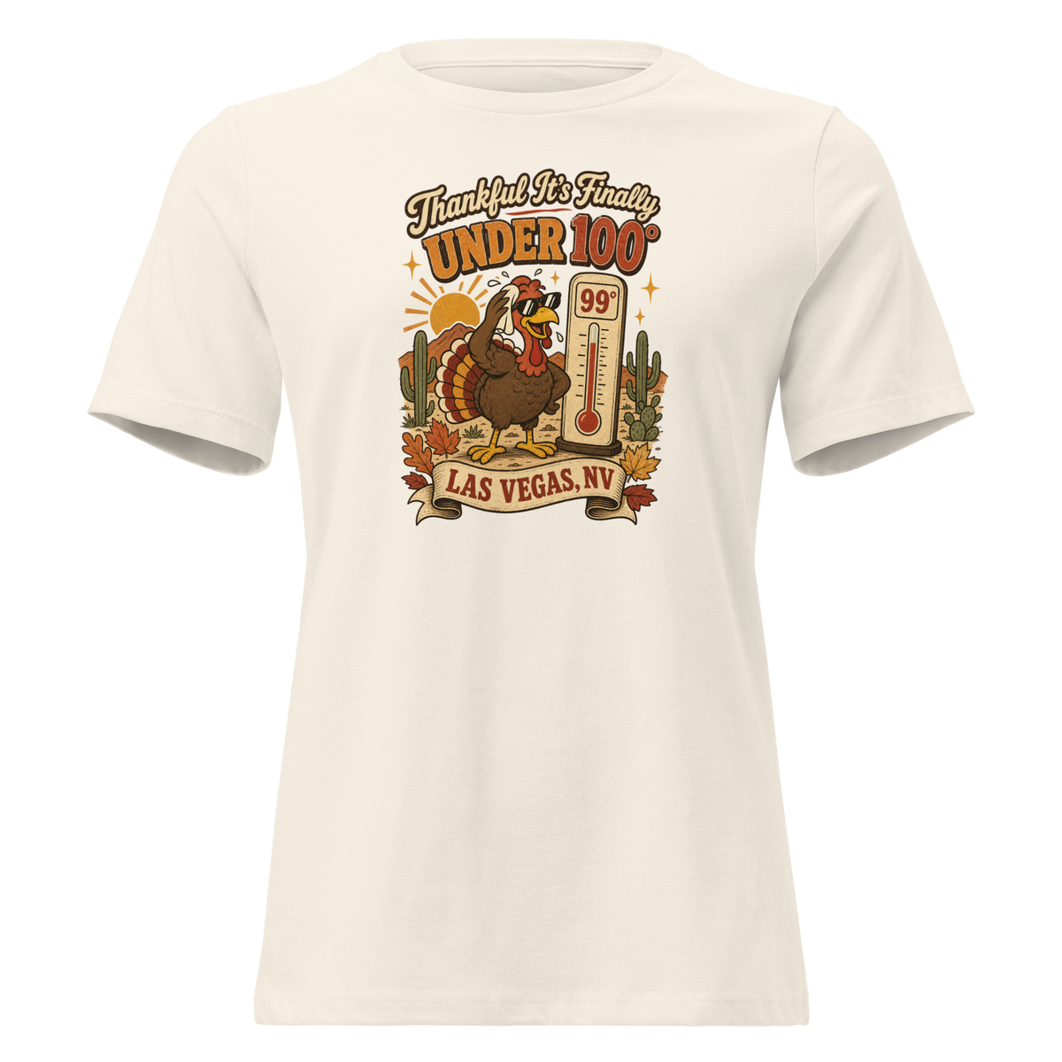 Thankful It's Finally Under 100 Relaxed T-Shirt in Natural, front view, Turkey in sunglasses by a 99 degree thermometer, cactus and fall leaves
