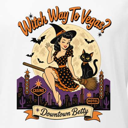 Witch Way To Vegas V-Neck in Solid White Blend, close-up of the front print, Downtown Betty pinup witch on a broom over a neon Vegas skyline
