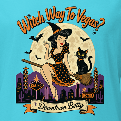 Witch Way To Vegas V-Neck in Turquoise, close-up of the front print, Downtown Betty pinup witch on a broom over a neon Vegas skyline