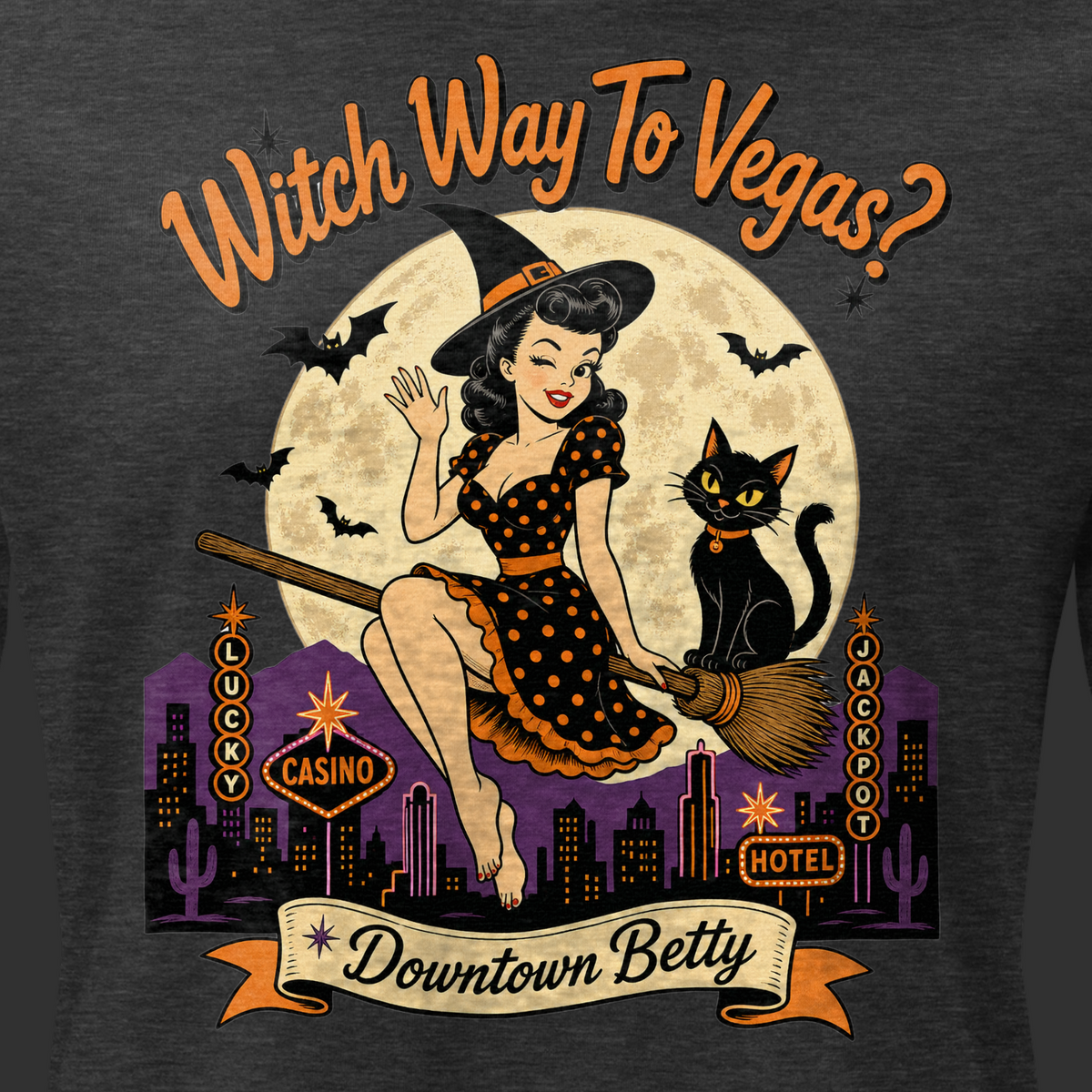 Witch Way To Vegas Relaxed T-Shirt in Dark Grey Heather, close-up of the front print, Downtown Betty pinup witch on a broom over neon Vegas